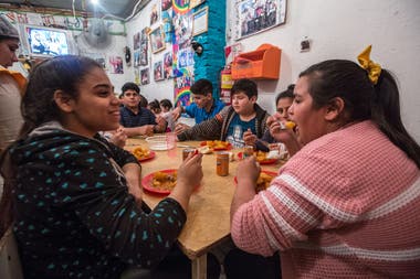 Some of the children who attend the All for Boys dining room, in the Loyola neighborhood, in San Martín
