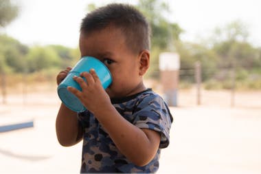 A child drinks water at School No. 1034, Lot 76, in Miraflores